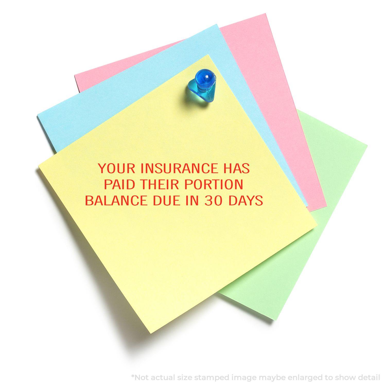 Large Your Insurance Has Paid Their Portion rubber stamp on colorful sticky notes with a blue pushpin.