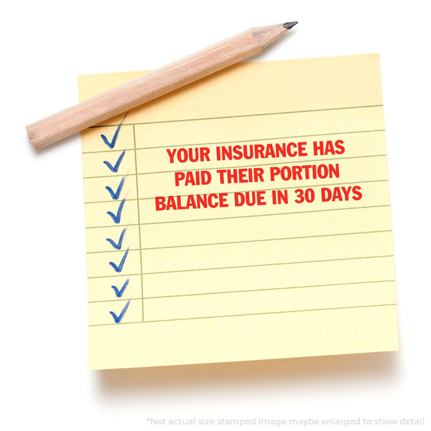 Yellow sticky note with blue checkmarks and red text stamped YOUR INSURANCE HAS PAID THEIR PORTION BALANCE DUE IN 30 DAYS using Large Pre-Inked Your Insurance Has Paid Their Portion Stamp.