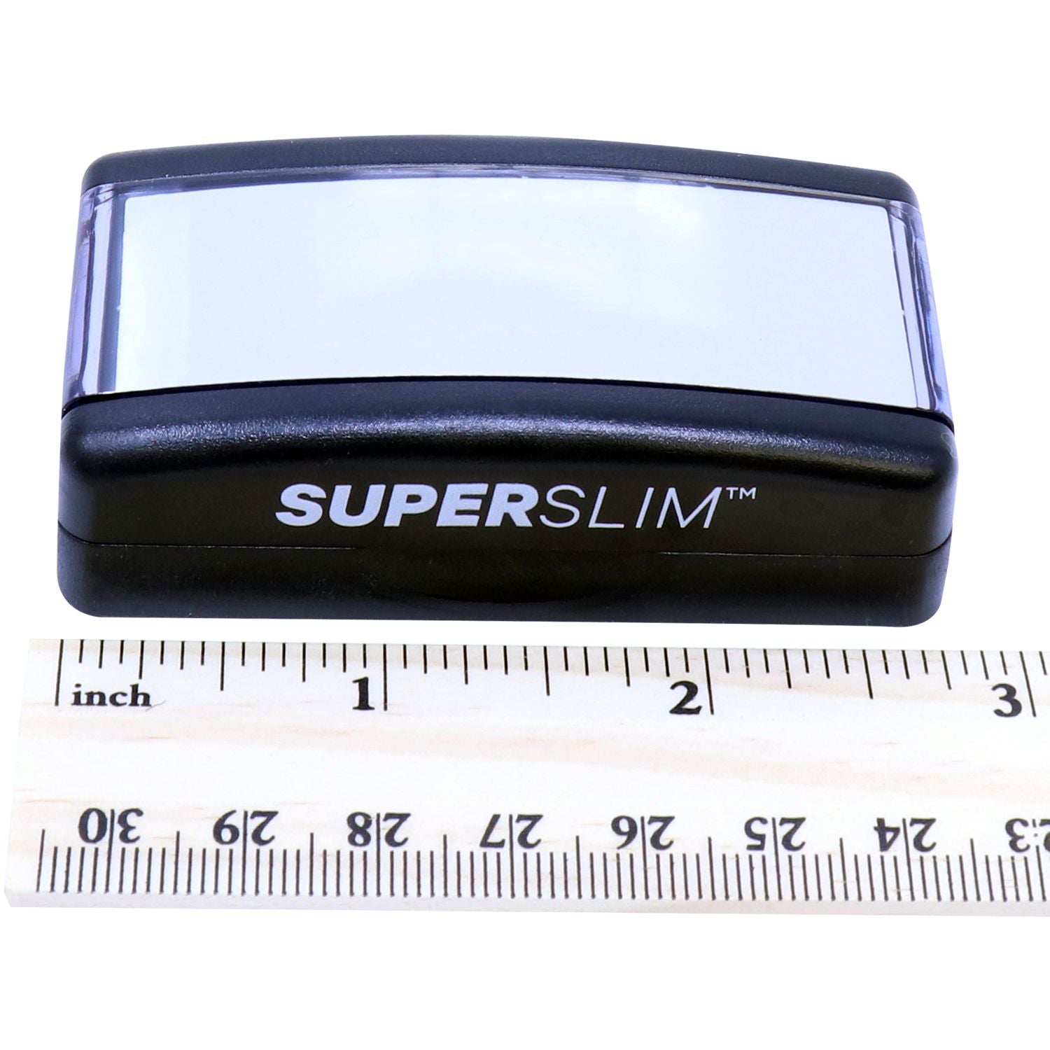 Super Slim 2564 Customized Pre-Inked Stamp 1 x 2-3/8 shown with a ruler for scale, highlighting its compact and sleek design.