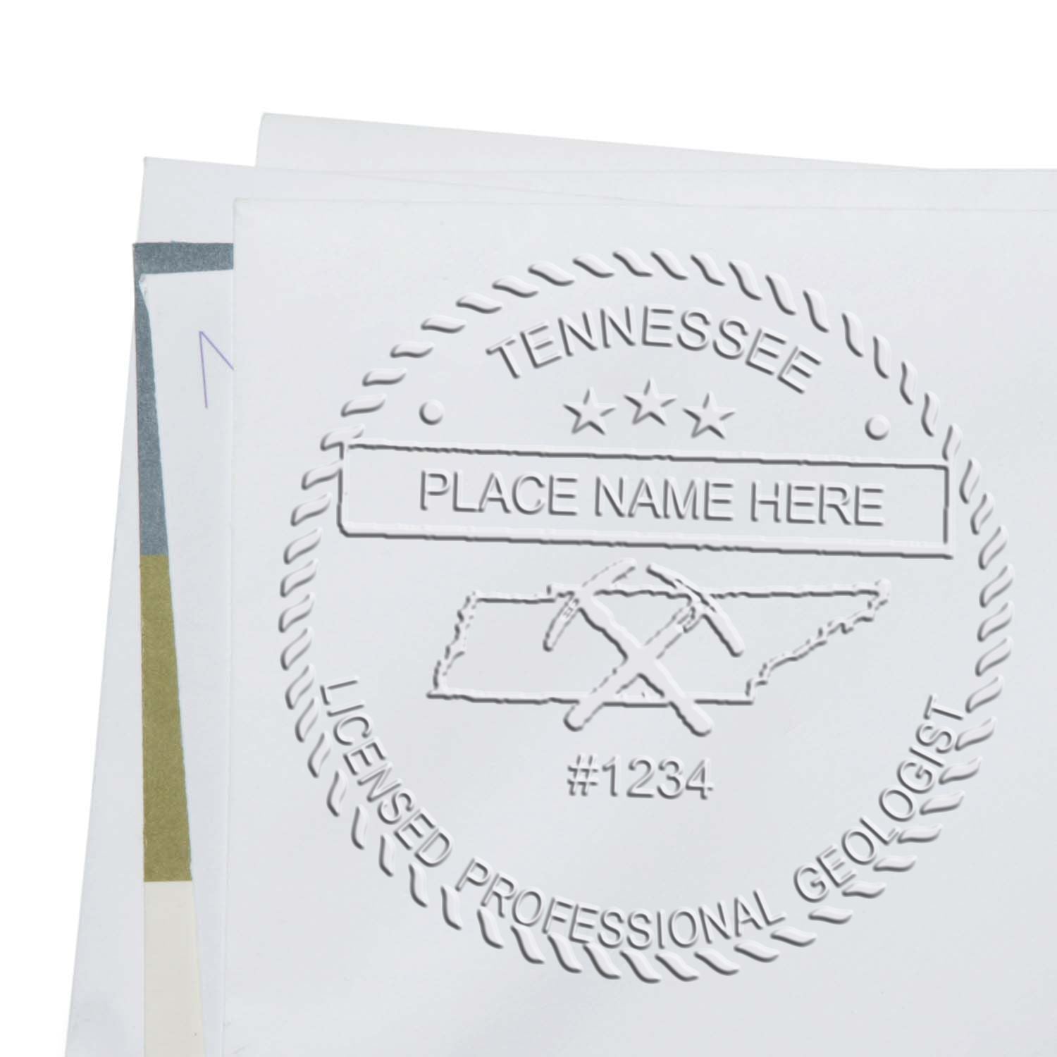 An alternative view of the Handheld Tennessee Professional Geologist Embosser stamped on a sheet of paper showing the image in use