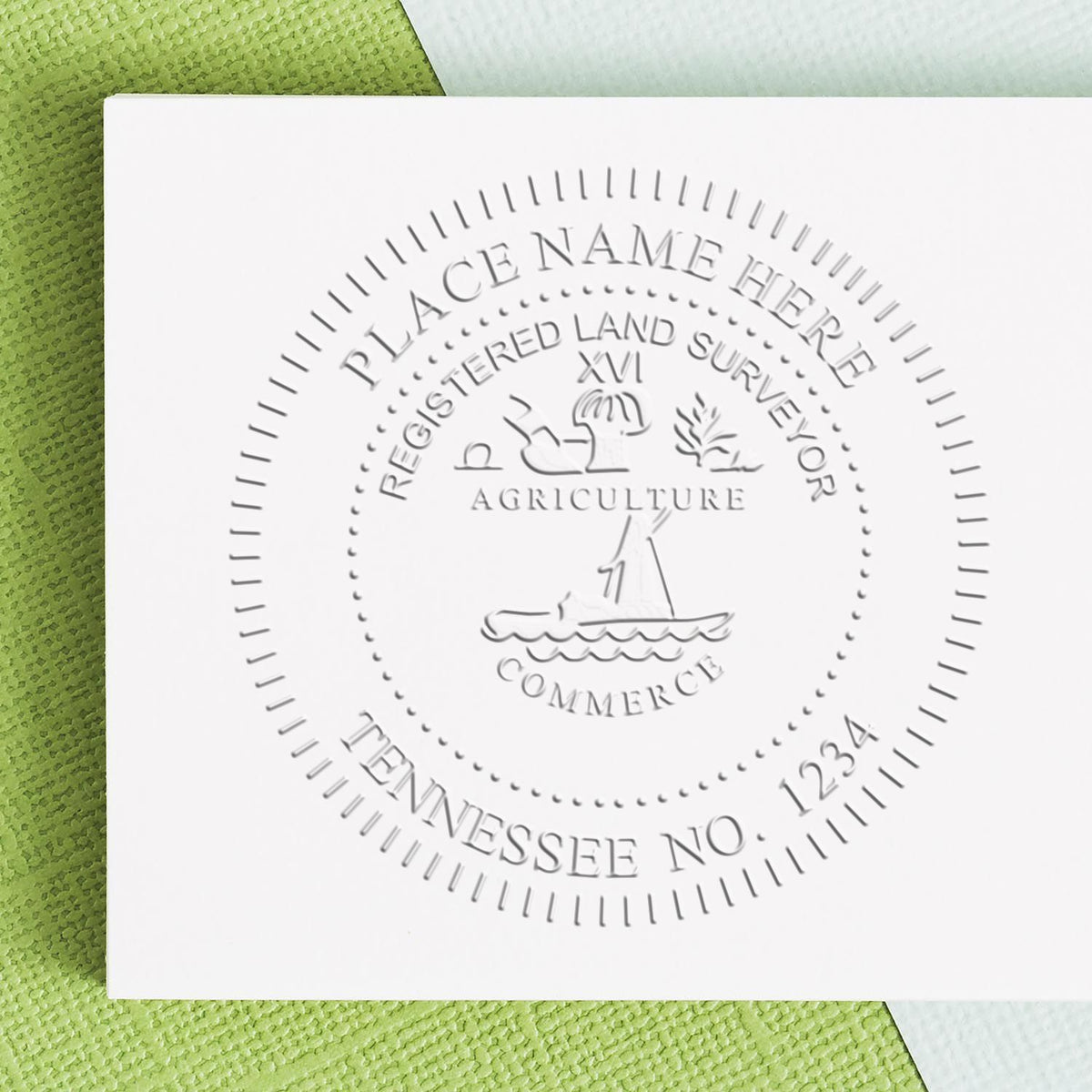 An alternative view of the Hybrid Tennessee Land Surveyor Seal stamped on a sheet of paper showing the image in use