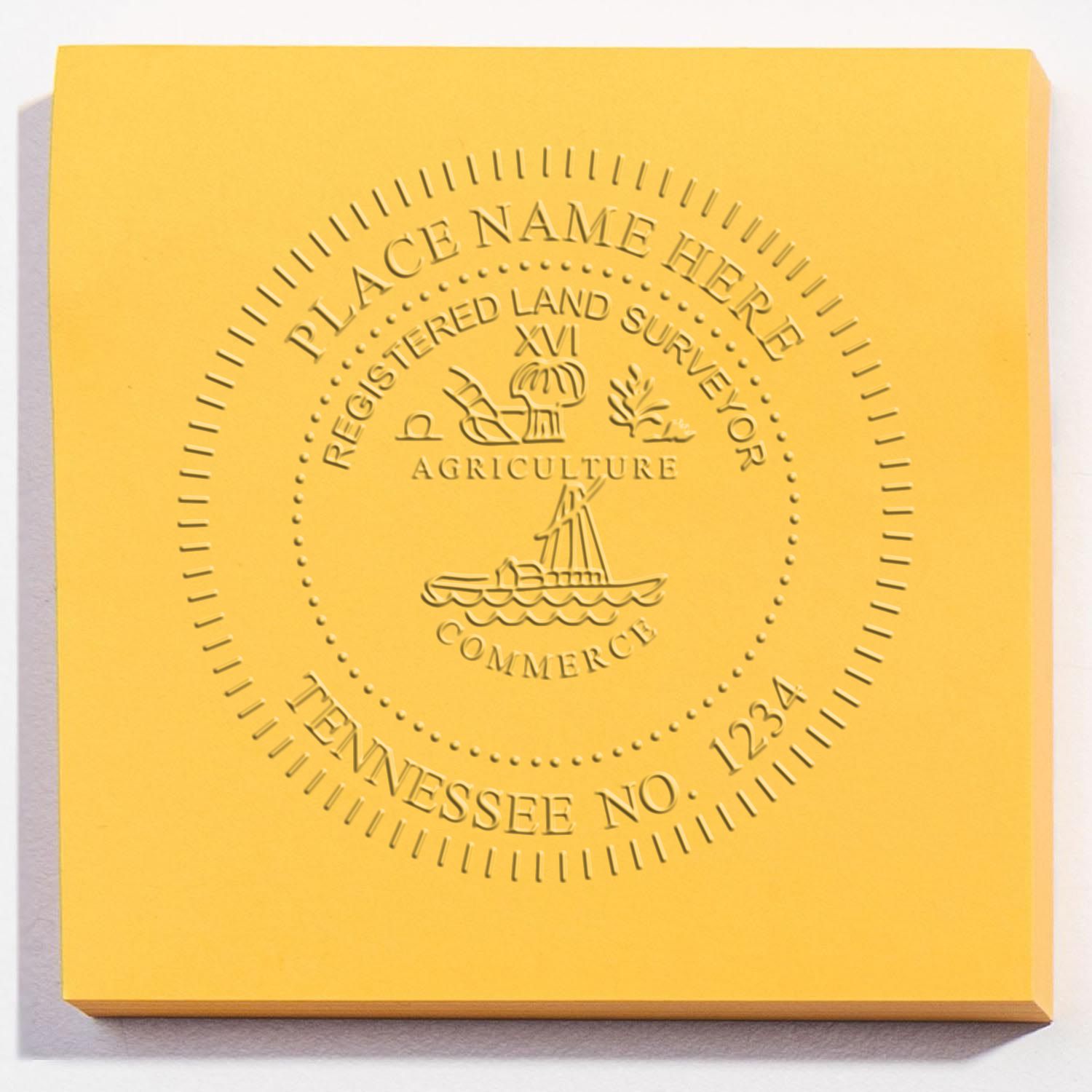 A lifestyle photo showing a stamped image of the Tennessee Desk Surveyor Seal Embosser on a piece of paper