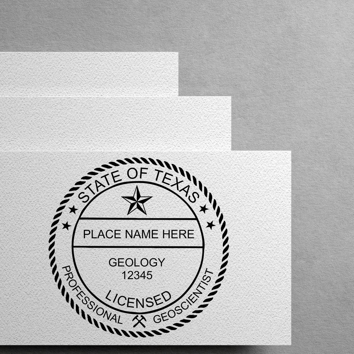 A lifestyle photo showing a stamped image of the Self-Inking Texas Geologist Stamp on a piece of paper