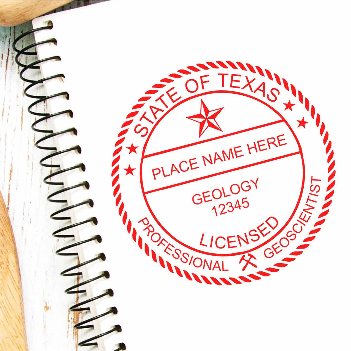 An in use photo of the Slim Pre-Inked Texas Professional Geologist Seal Stamp showing a sample imprint on a cardstock