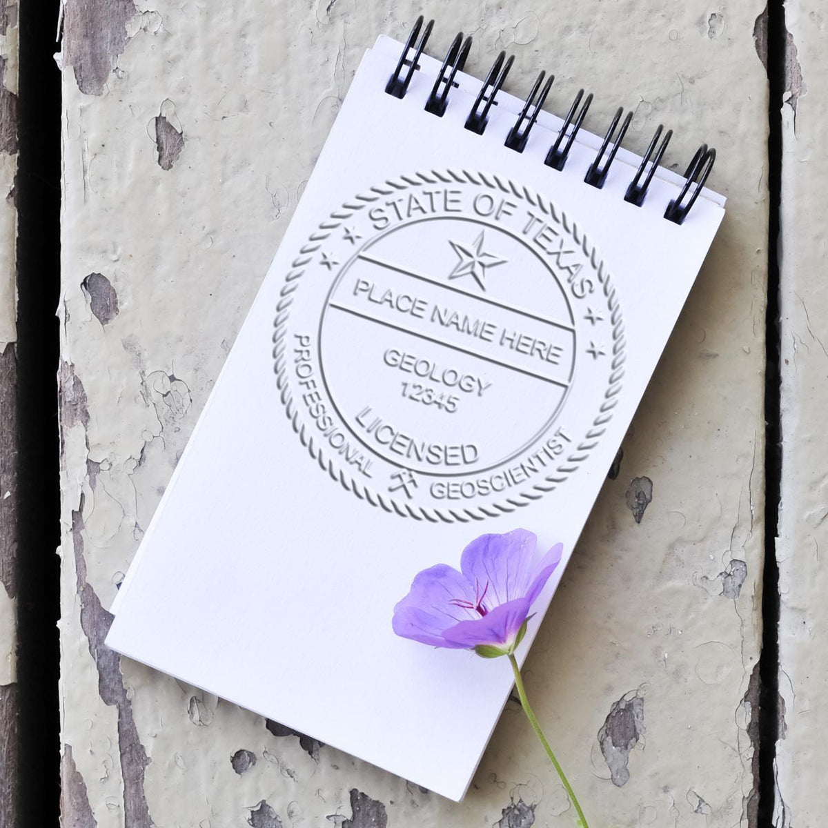A stamped imprint of the State of Texas Extended Long Reach Geologist Seal in this stylish lifestyle photo, setting the tone for a unique and personalized product.