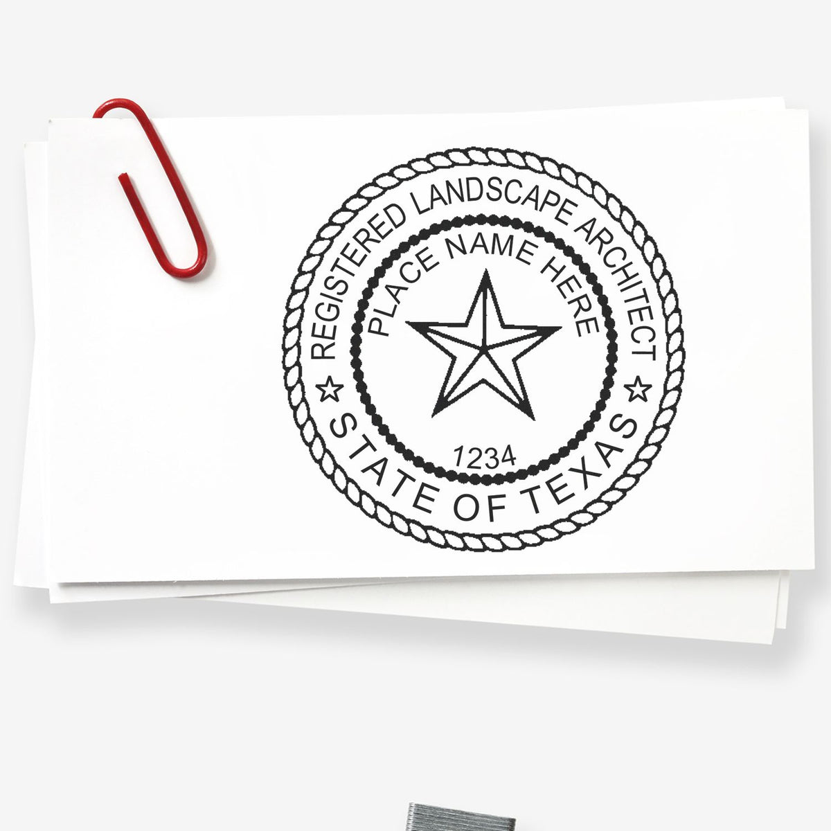 A lifestyle photo showing a stamped image of the Texas Landscape Architectural Seal Stamp on a piece of paper