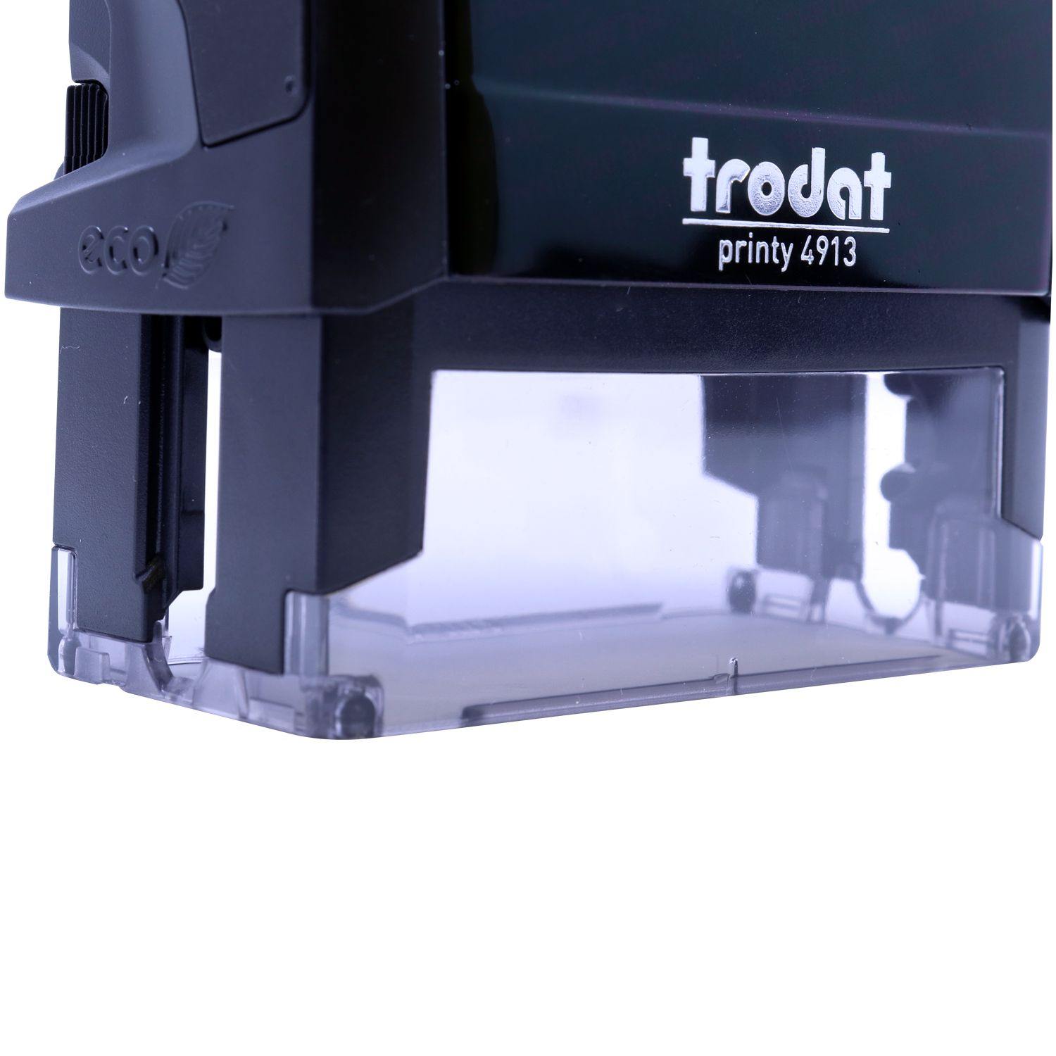 Close-up of a Trodat Printy 4913 Self Inking Preliminary Stamp with a clear base, showing the eco-friendly design and branding.