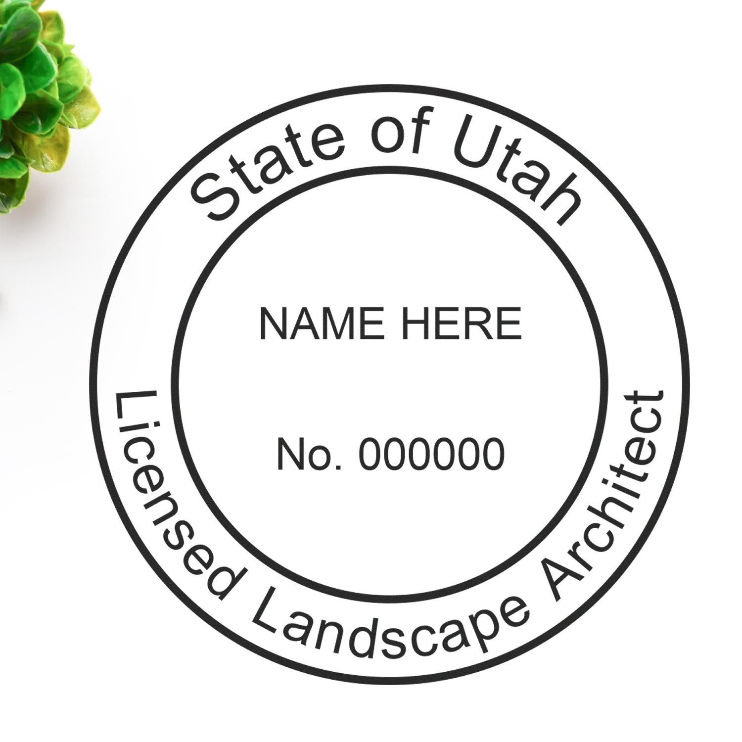 A lifestyle photo showing a stamped image of the Digital Utah Landscape Architect Stamp on a piece of paper