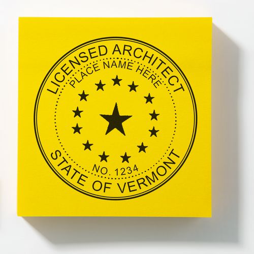 A lifestyle photo showing a stamped image of the Slim Pre-Inked Vermont Architect Seal Stamp on a piece of paper