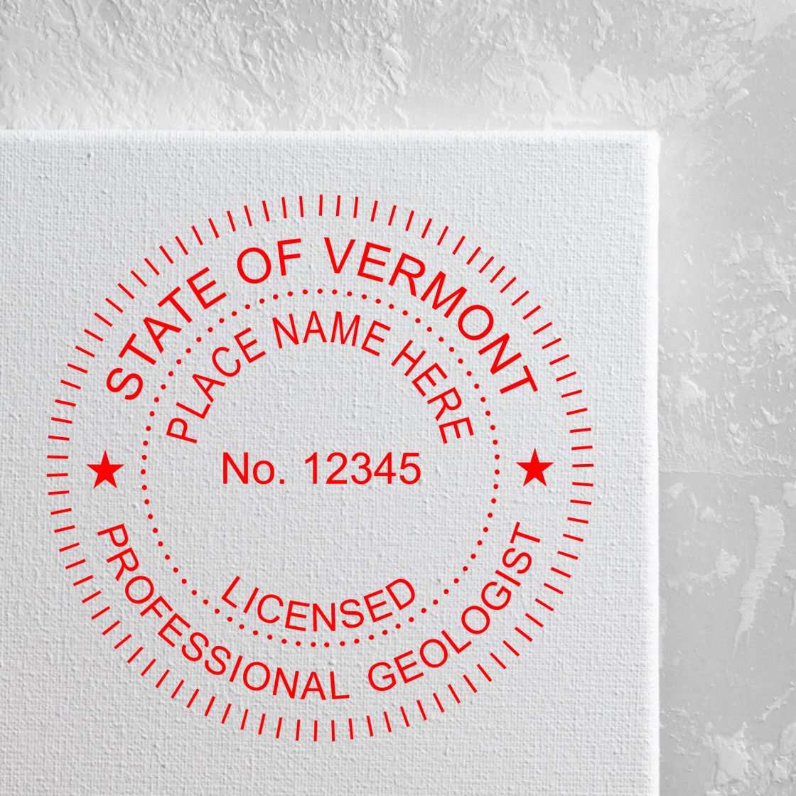 An in use photo of the Premium MaxLight Pre-Inked Vermont Geology Stamp showing a sample imprint on a cardstock