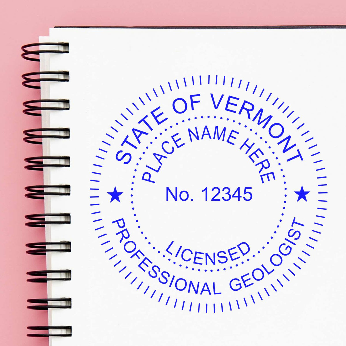 An alternative view of the Slim Pre-Inked Vermont Professional Geologist Seal Stamp stamped on a sheet of paper showing the image in use
