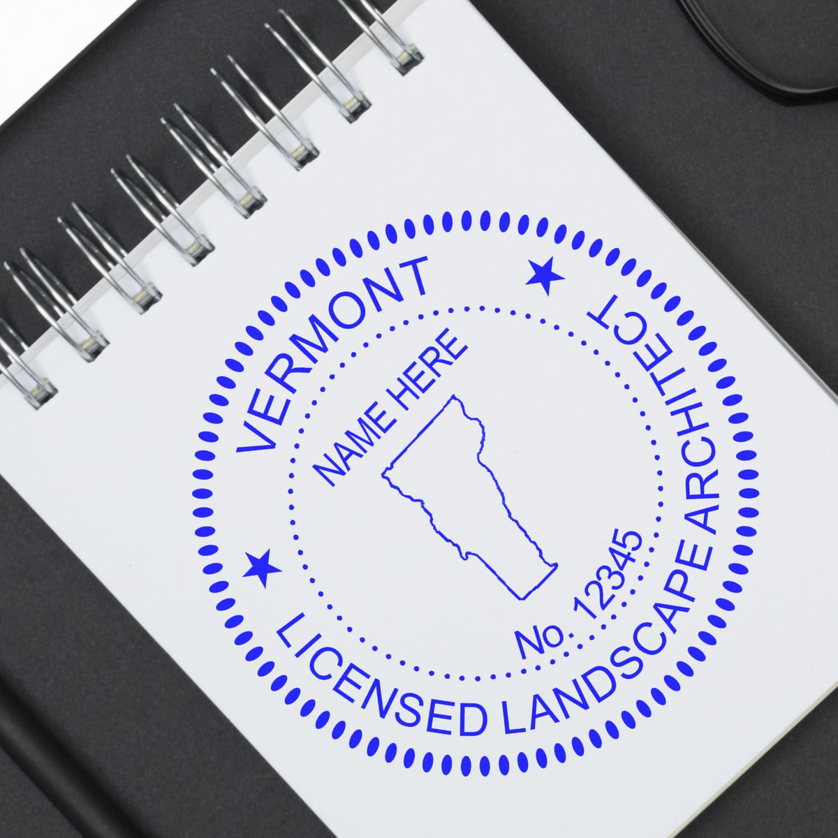 This paper is stamped with a sample imprint of the Self-Inking Vermont Landscape Architect Stamp, signifying its quality and reliability.