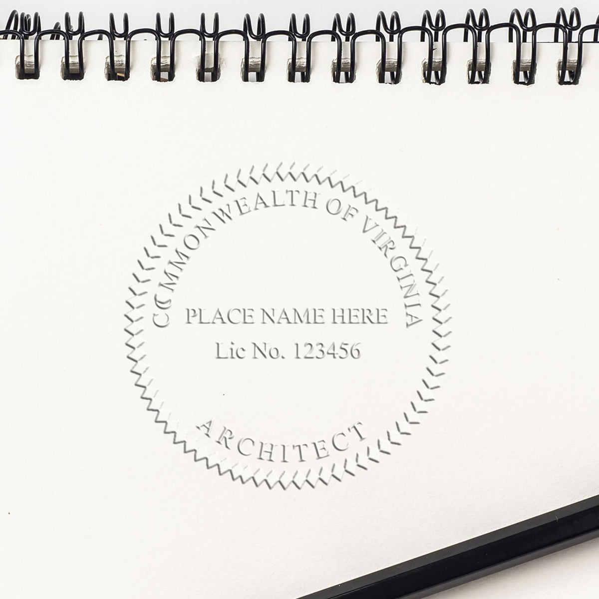 This paper is stamped with a sample imprint of the Extended Long Reach Virginia Architect Seal Embosser, signifying its quality and reliability.