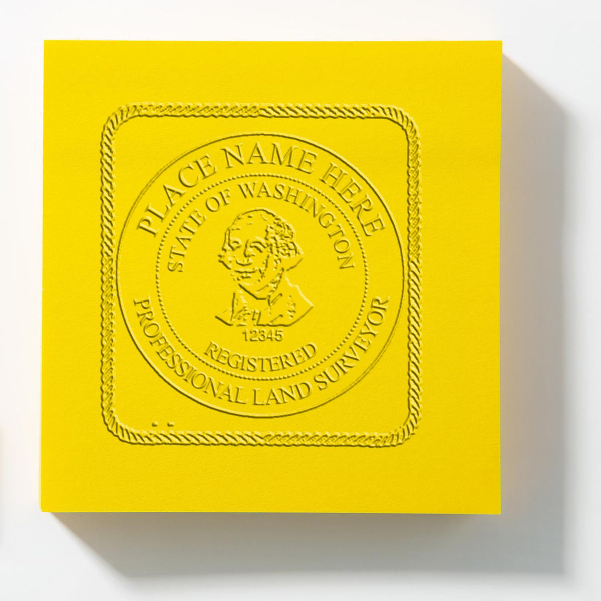 An in use photo of the Gift Washington Land Surveyor Seal showing a sample imprint on a cardstock