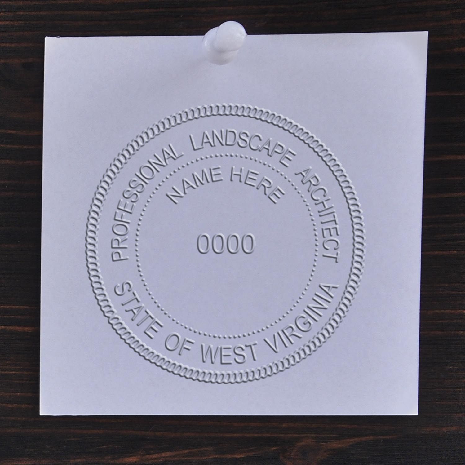 A stamped imprint of the Gift West Virginia Landscape Architect Seal in this stylish lifestyle photo, setting the tone for a unique and personalized product.