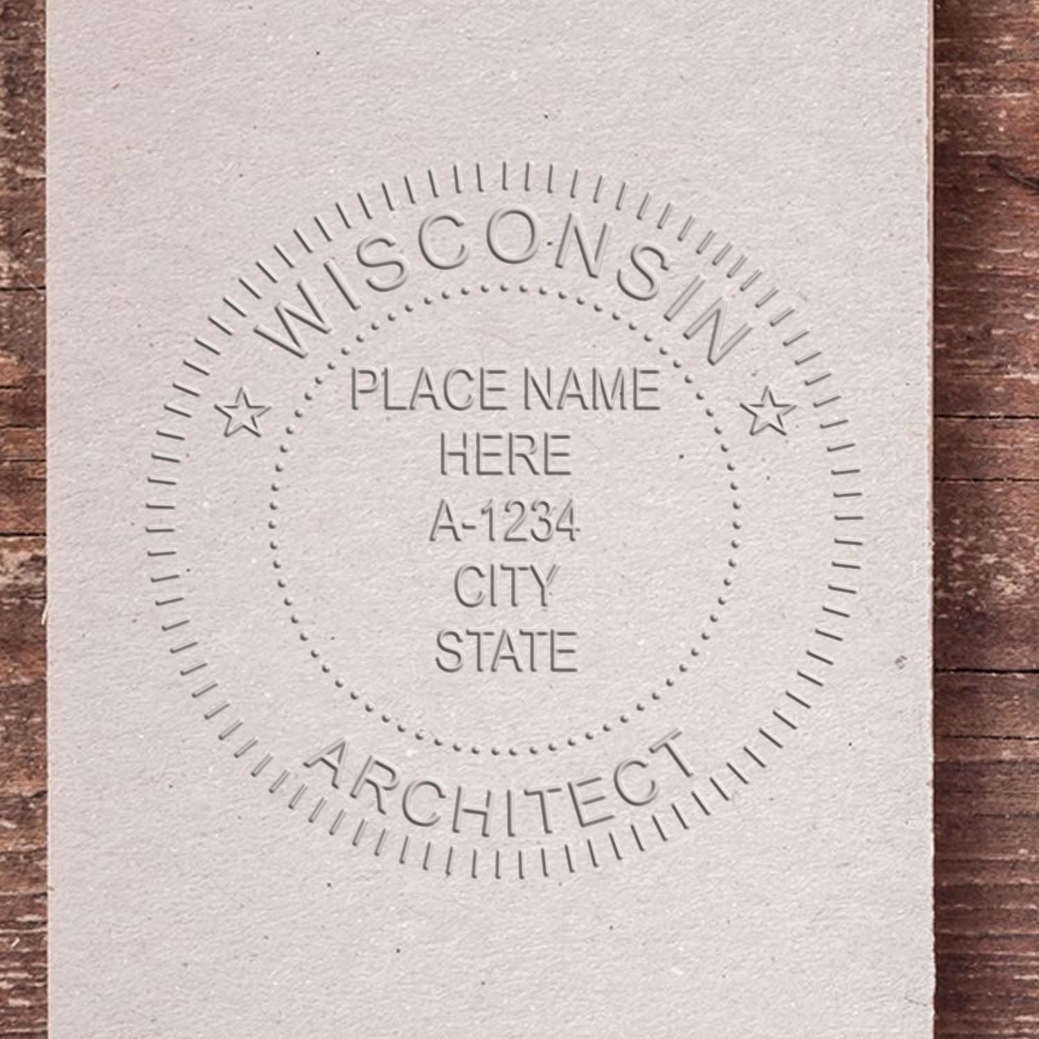 A stamped impression of the Handheld Wisconsin Architect Seal Embosser in this stylish lifestyle photo, setting the tone for a unique and personalized product.