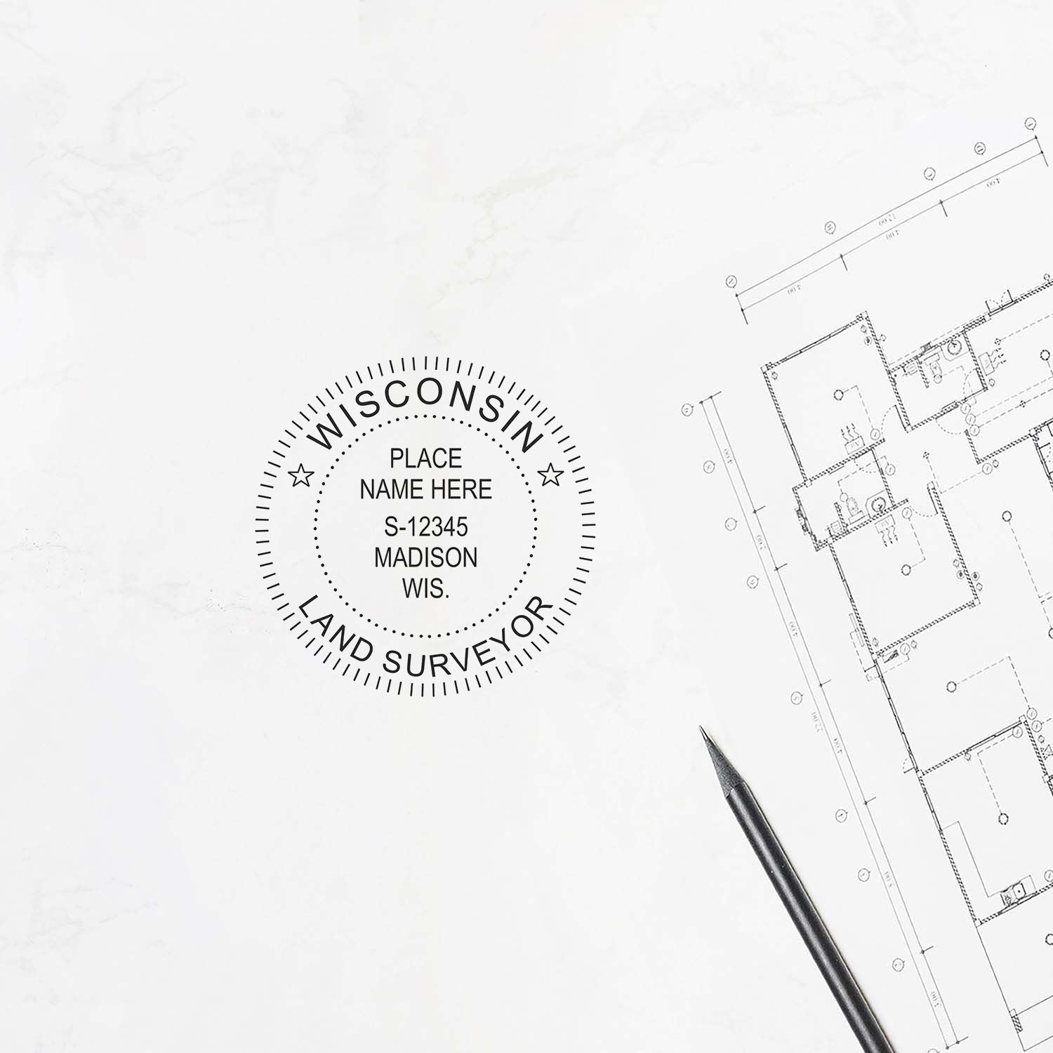 Premium MaxLight Pre-Inked Wisconsin Surveyors Stamp in use on a white paper next to a pen and architectural blueprint.