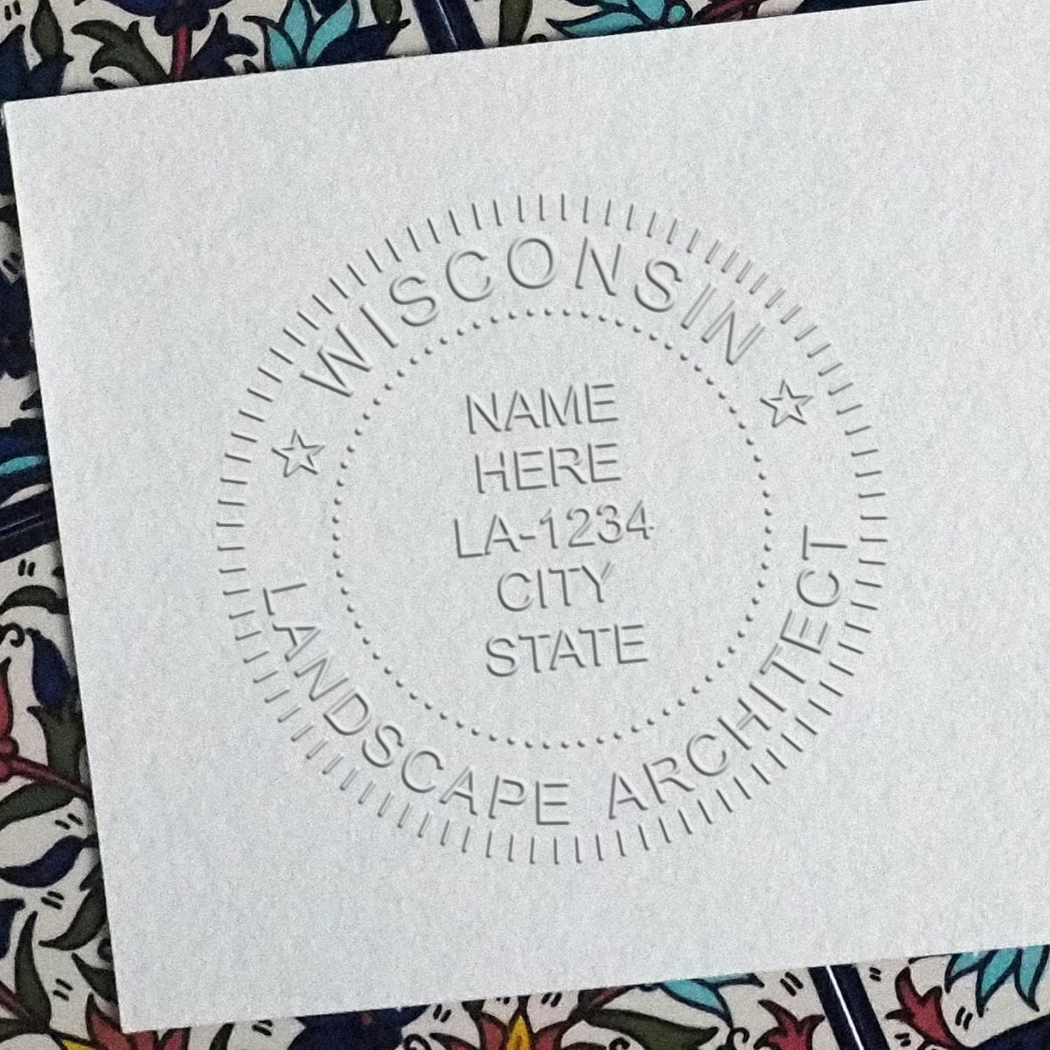 A photograph of the Hybrid Wisconsin Landscape Architect Seal stamp impression reveals a vivid, professional image of the on paper.