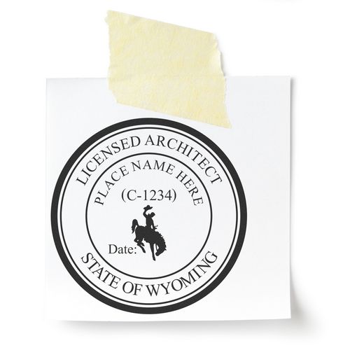 A lifestyle photo showing a stamped image of the Slim Pre-Inked Wyoming Architect Seal Stamp on a piece of paper