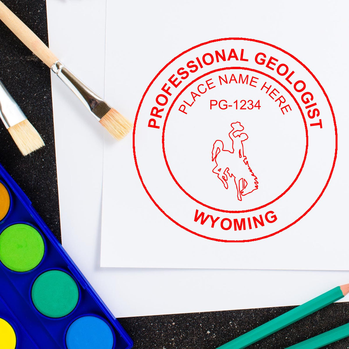 A lifestyle photo showing a stamped image of the Wyoming Professional Geologist Seal Stamp on a piece of paper