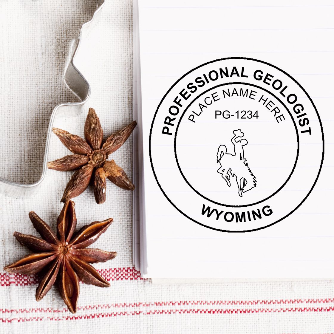 A lifestyle photo showing a stamped image of the Slim Pre-Inked Wyoming Professional Geologist Seal Stamp on a piece of paper