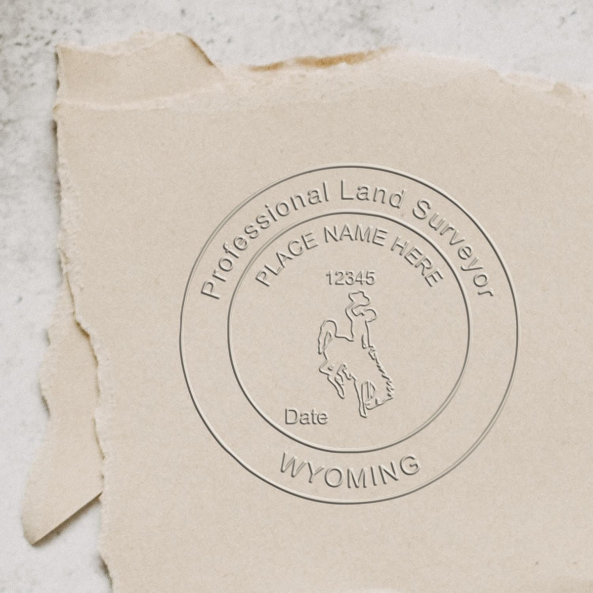 A photograph of the State of Wyoming Soft Land Surveyor Embossing Seal stamp impression reveals a vivid, professional image of the on paper.
