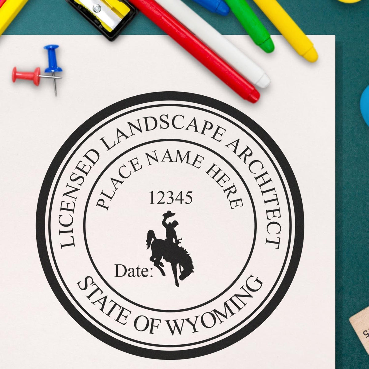 This paper is stamped with a sample imprint of the Premium MaxLight Pre-Inked Wyoming Landscape Architectural Stamp, signifying its quality and reliability.