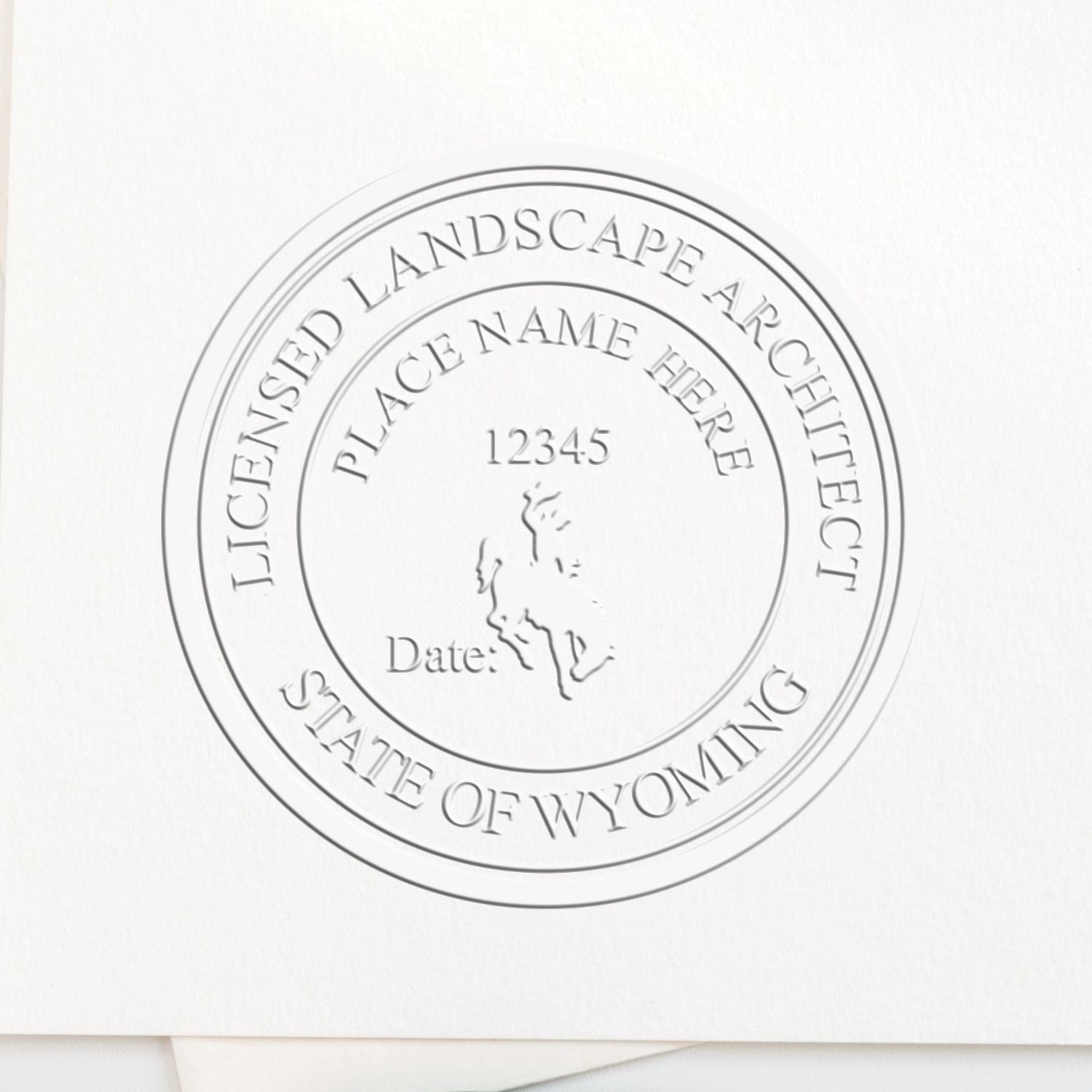 A stamped impression of the State of Wyoming Extended Long Reach Landscape Architect Seal Embosser in this stylish lifestyle photo, setting the tone for a unique and personalized product.