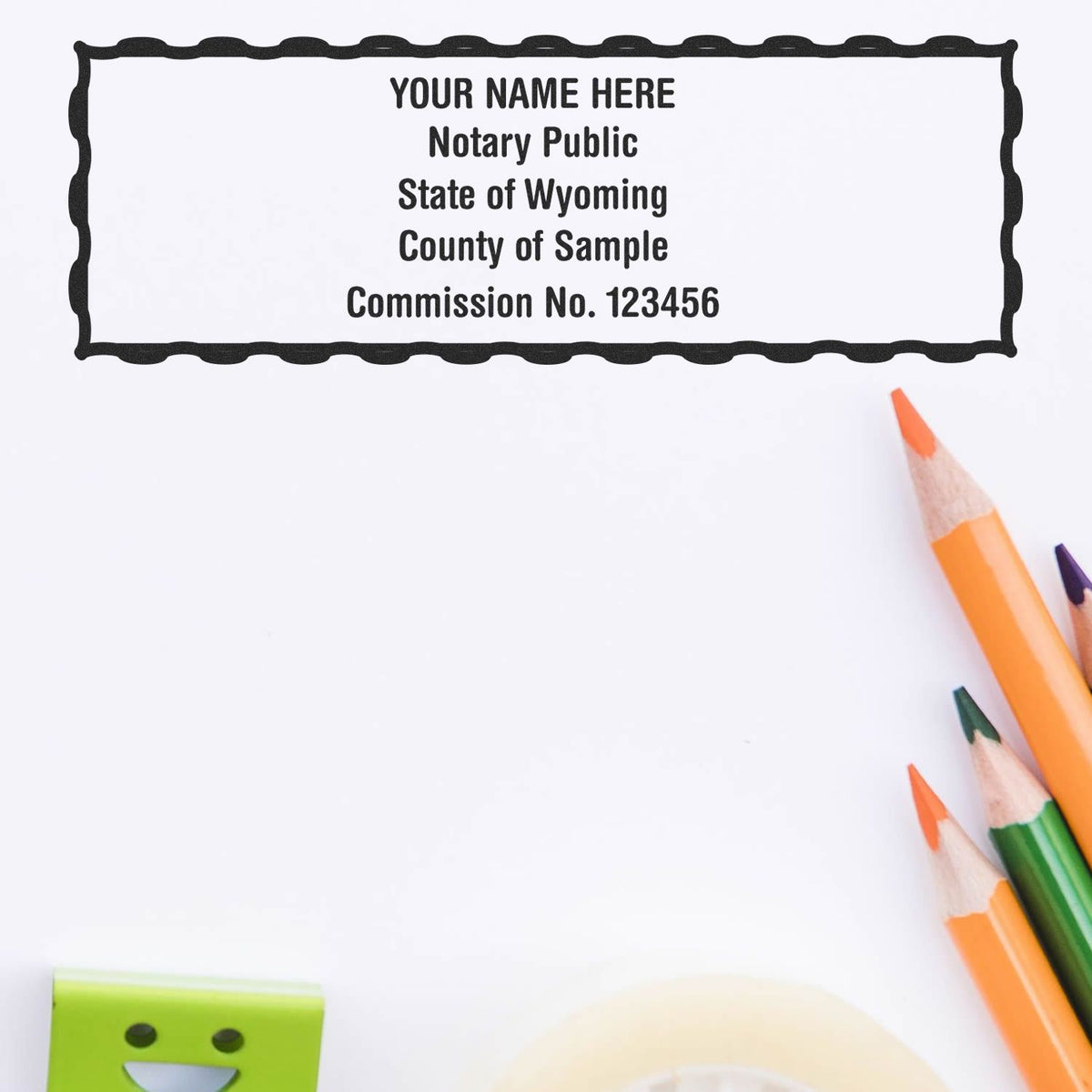 A lifestyle photo showing a stamped image of the Heavy-Duty Wyoming Rectangular Notary Stamp on a piece of paper