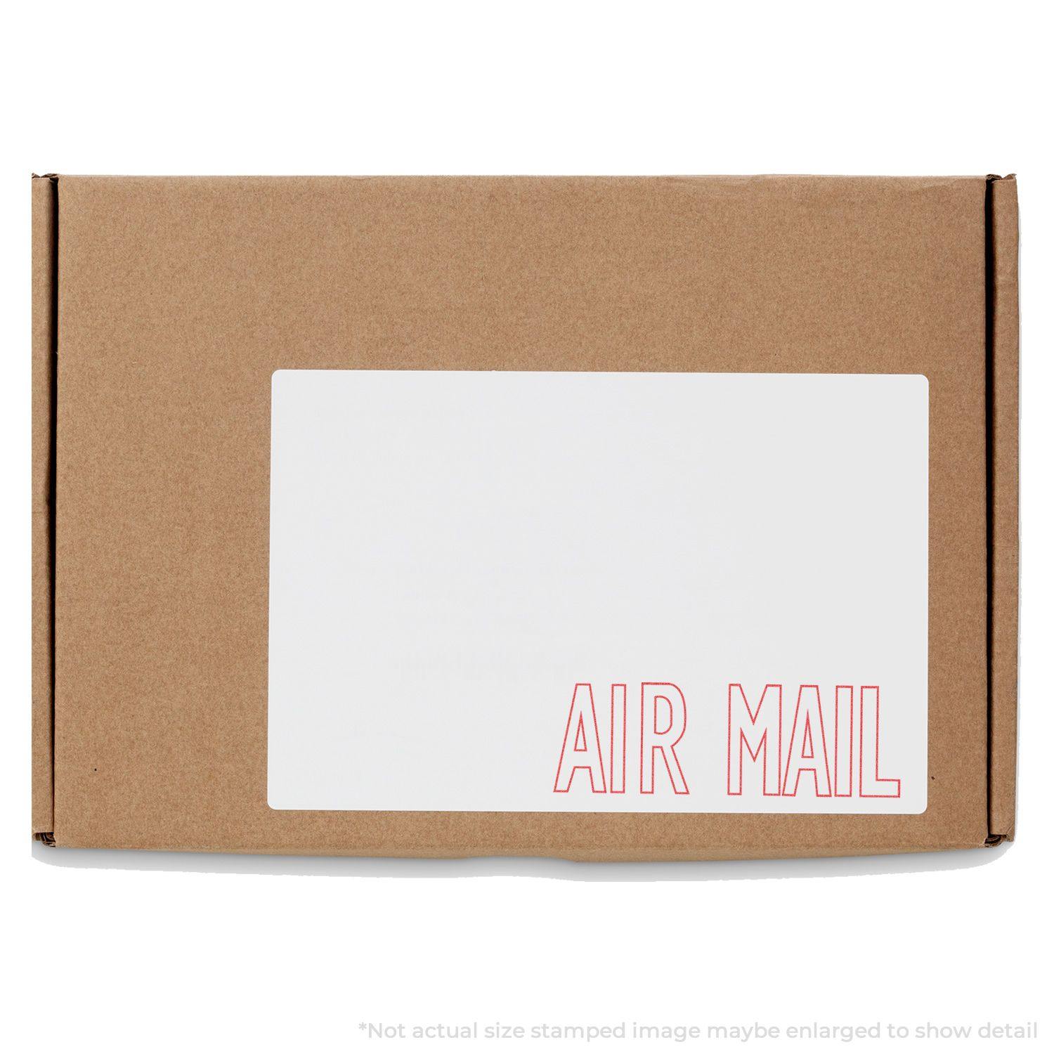 Brown package with a white label stamped AIR MAIL in red using the Air Mail Xstamper Stamp.