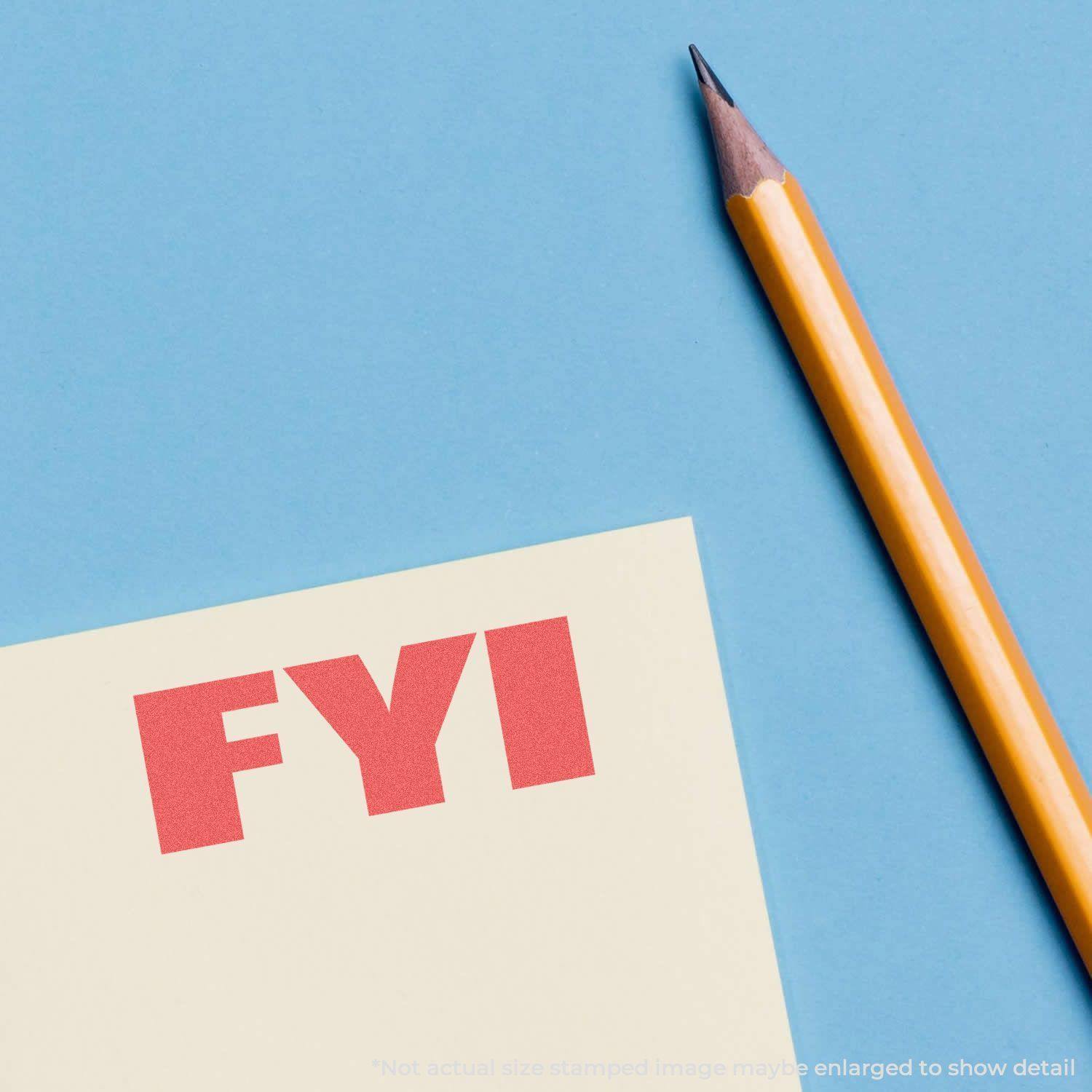 Yellow pencil next to a paper stamped with FYI in bold red using the Bold Red FYI Xstamper Stamp on a blue background.