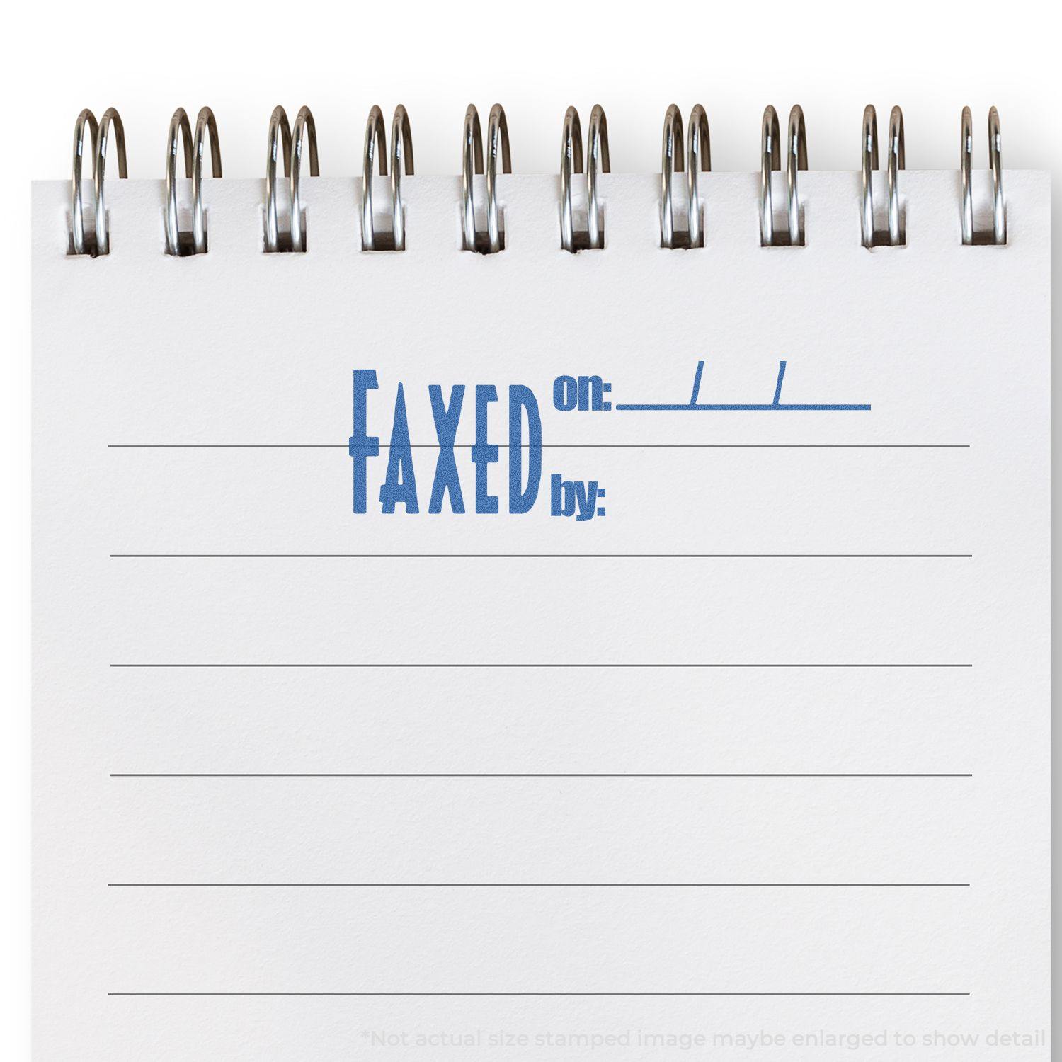 Notepad with FAXED on: ___ by: ___ stamped in blue using the Faxed On: By: Xstamper Stamp.