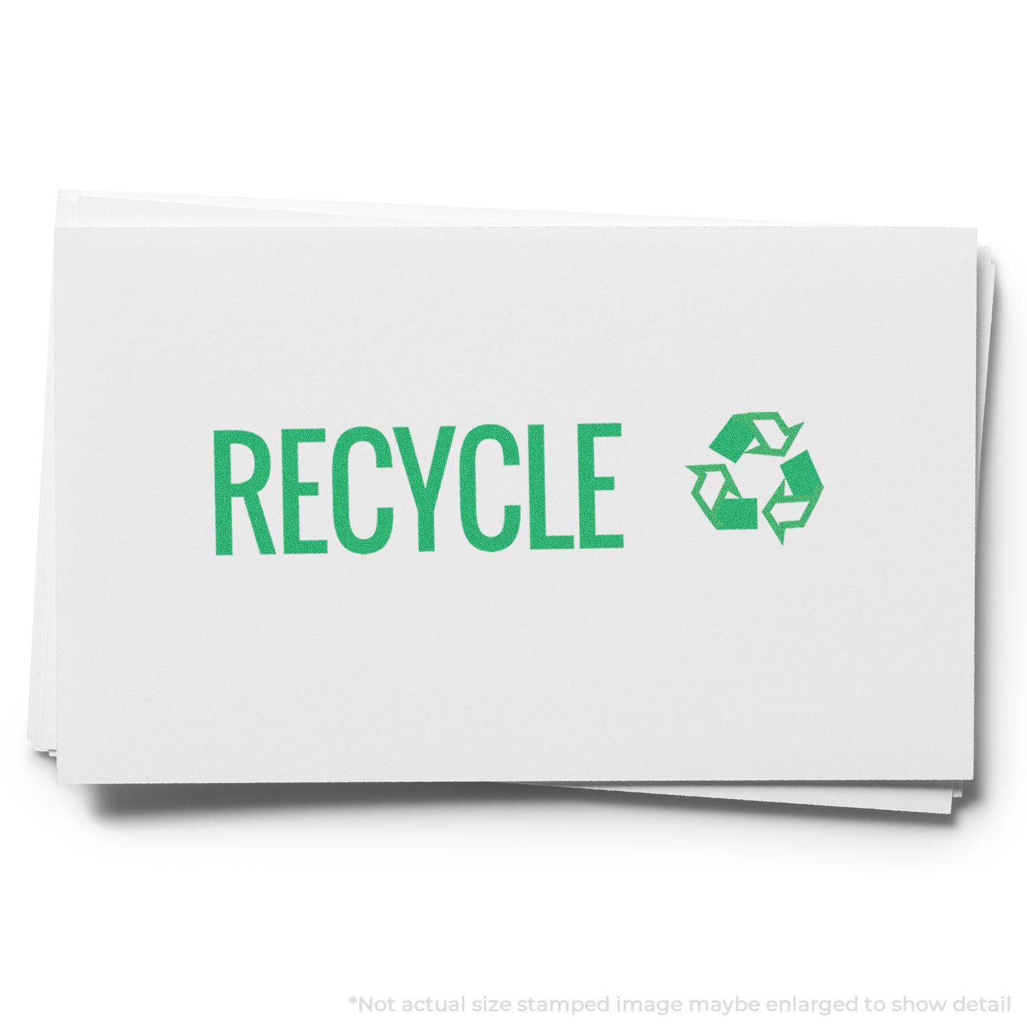 Green Recycle Xstamper Stamp imprint on white paper, displaying the word RECYCLE in green with a recycling symbol next to it.