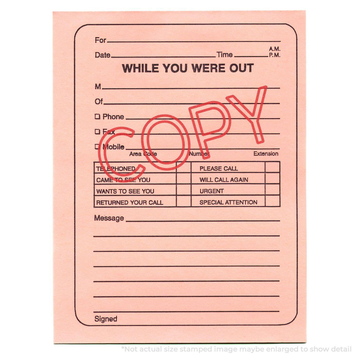 Jumbo Red Copy Xstamper Stamp used on a pink 'While You Were Out' note, with the word 'COPY' stamped prominently in red ink.