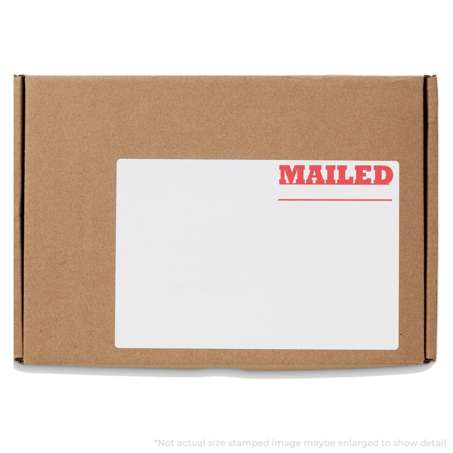 A brown package with a white label stamped MAILED in red using the Mailed Xstamper Stamp.