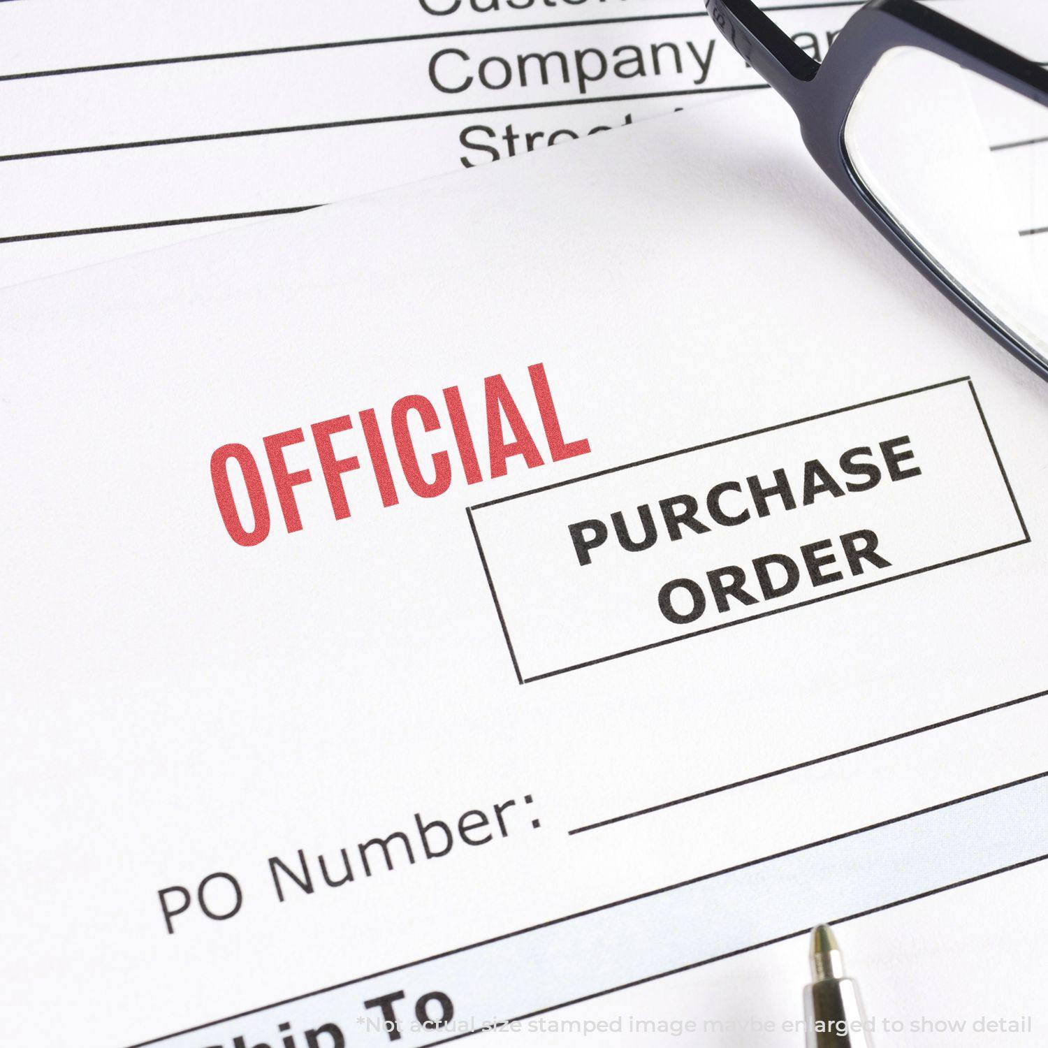 Official Xstamper Stamp marking OFFICIAL on a purchase order document, with glasses and a pen nearby.