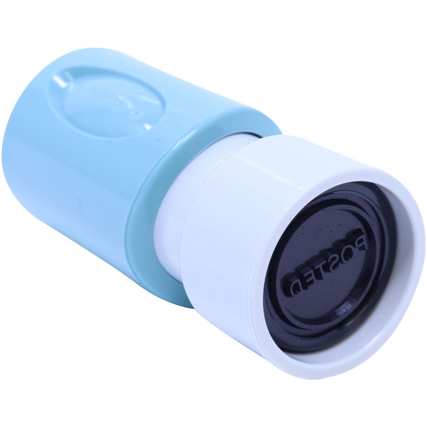 Round OK'D By Xstamper Stamp with a blue handle and black stamp face, displayed at a tilted angle on a white background.